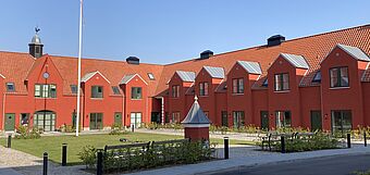[Translate to Swedish:] [Translate to Danish:] Houses painted with KEIM Granital in a dark red