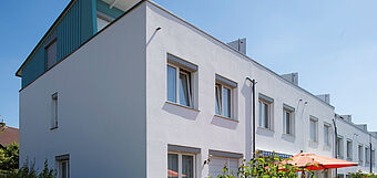 [Translate to Italian:] Terraced white houses painted with KEIM Veramin